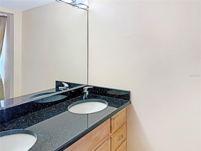10346 Carrollwood Ln Unit 171, Tampa, FL 33618 - bathroom featuring double vanity and a sink
