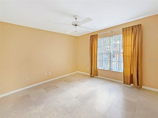 10346 Carrollwood Ln Unit 171, Tampa, FL 33618 - empty room featuring light tile patterned flooring, baseboards, and a ceiling fan