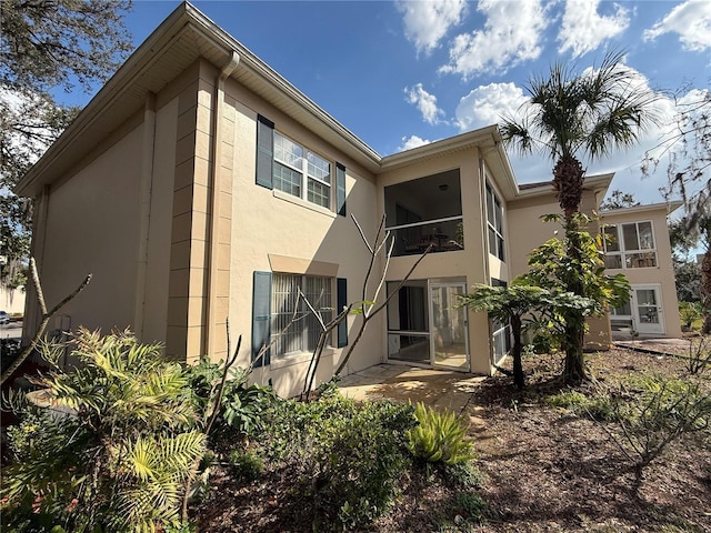 10346 Carrollwood Ln Unit 171, Tampa, FL 33618 - back of house with a patio area and stucco siding