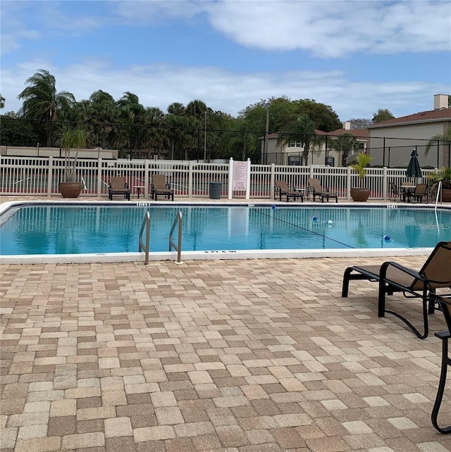 10346 Carrollwood Ln Unit 171, Tampa, FL 33618 - community pool featuring a patio area and fence