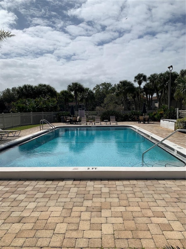 10346 Carrollwood Ln Unit 171, Tampa, FL 33618 - pool featuring a patio and fence