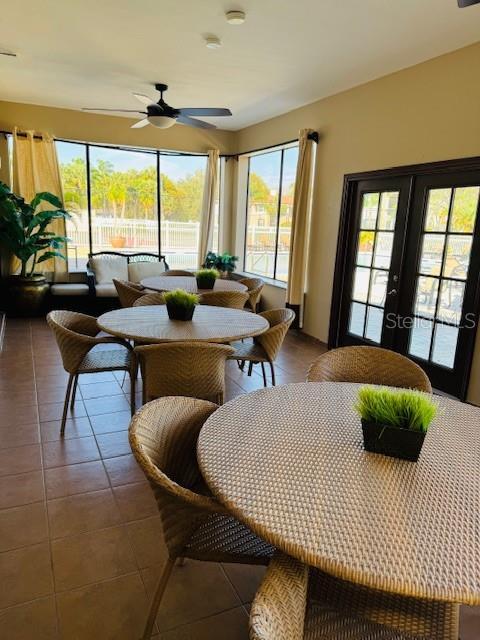 10346 Carrollwood Ln Unit 171, Tampa, FL 33618 - sunroom / solarium with french doors and a healthy amount of sunlight