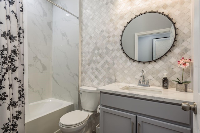 full bathroom with vanity, tiled shower / bath, decorative backsplash, and toilet