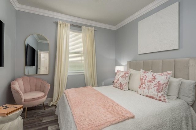 bedroom featuring ornamental molding and dark hardwood / wood-style floors