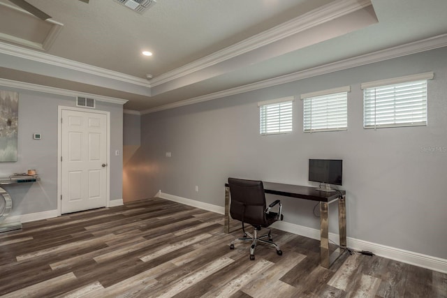 office area featuring dark wood-type flooring, ornamental molding, and a raised ceiling