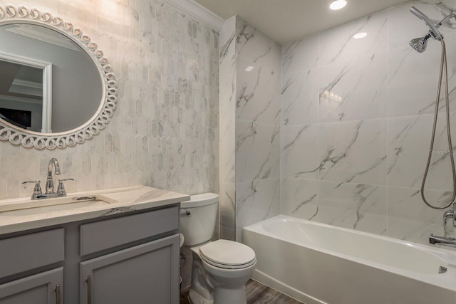 full bathroom with tiled shower / bath, vanity, toilet, and wood-type flooring