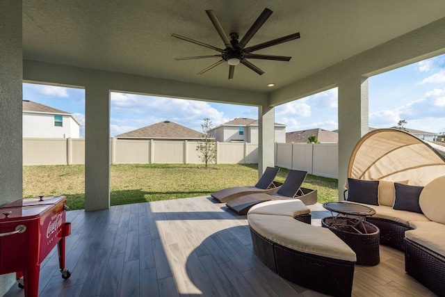 view of patio with ceiling fan and an outdoor living space