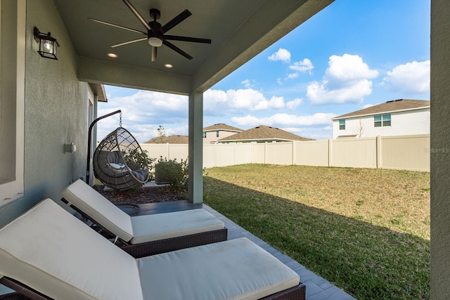 view of yard with a patio area and ceiling fan