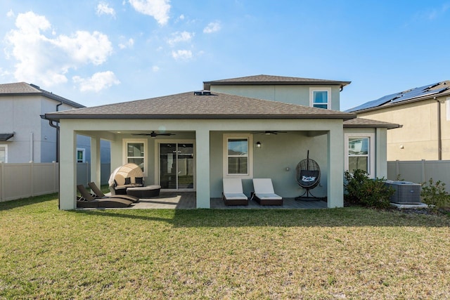 rear view of house with a yard, a patio area, and ceiling fan