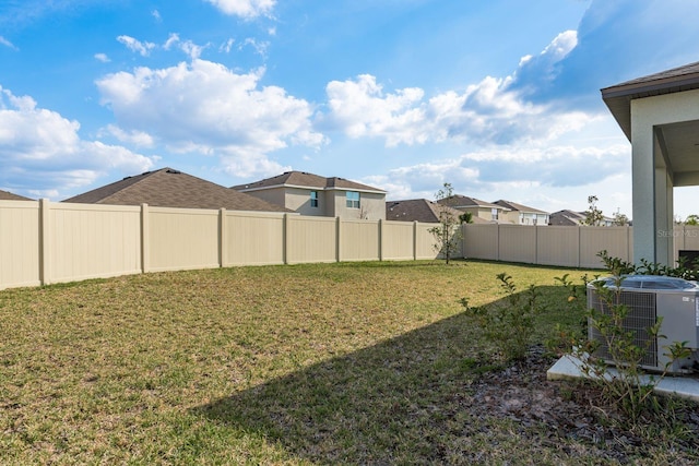 view of yard featuring central AC unit