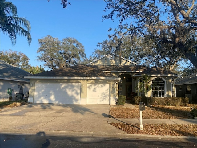 ranch-style house featuring a garage