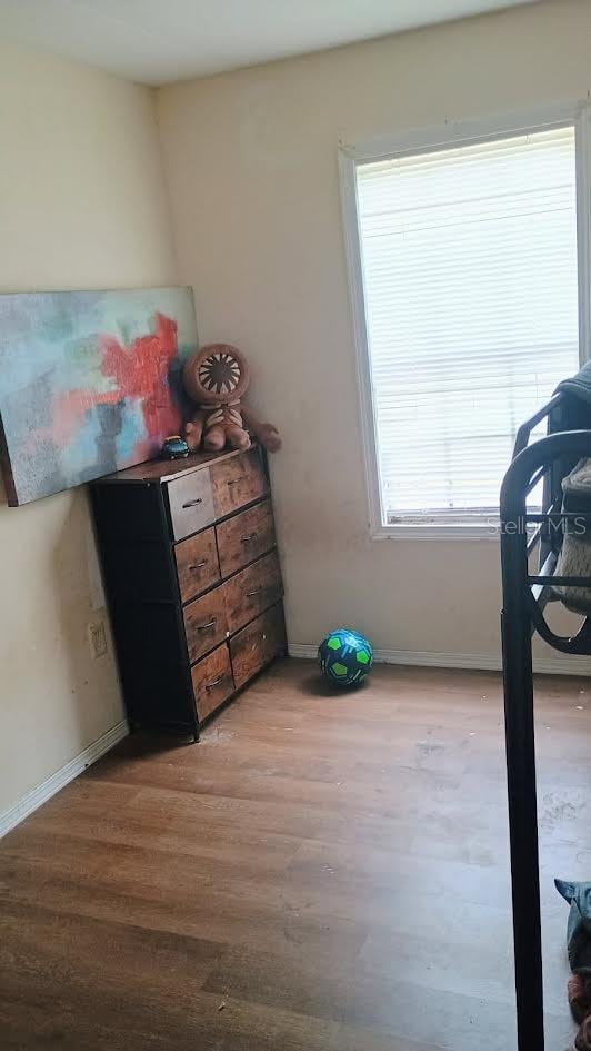 bedroom with light hardwood / wood-style floors