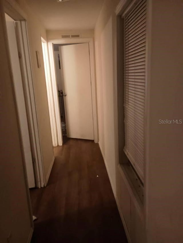 hallway featuring dark hardwood / wood-style floors