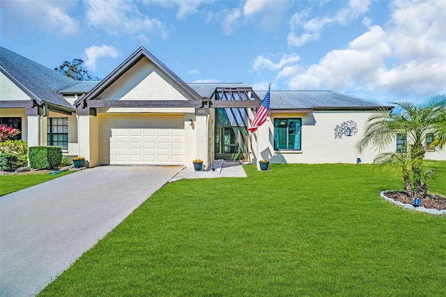 view of front of house featuring a garage and a front yard