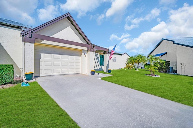 ranch-style house featuring a garage, central AC, and a front yard