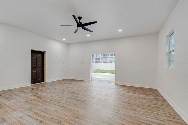 empty room with light hardwood / wood-style flooring and ceiling fan