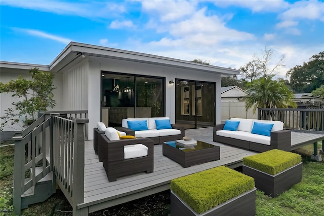 wooden terrace featuring an outdoor living space