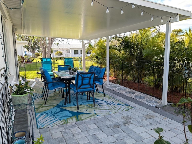 view of patio / terrace featuring outdoor dining space and fence