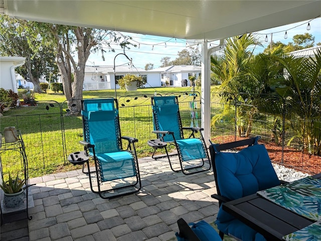 view of patio / terrace featuring fence