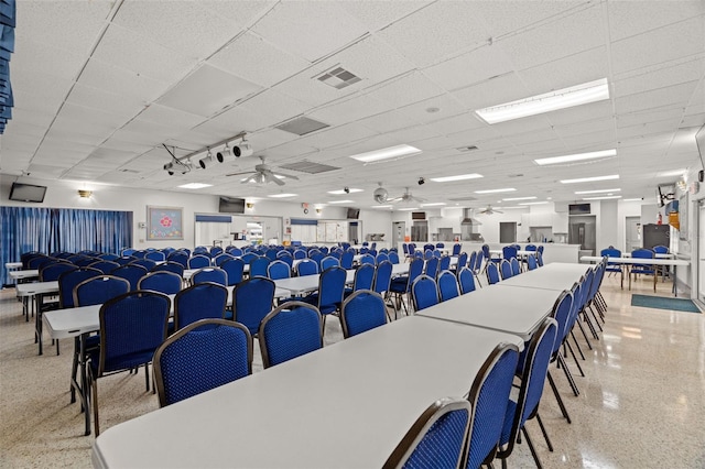 miscellaneous room featuring a paneled ceiling, visible vents, light speckled floor, and ceiling fan