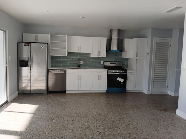 kitchen with appliances with stainless steel finishes, sink, white cabinets, backsplash, and wall chimney range hood