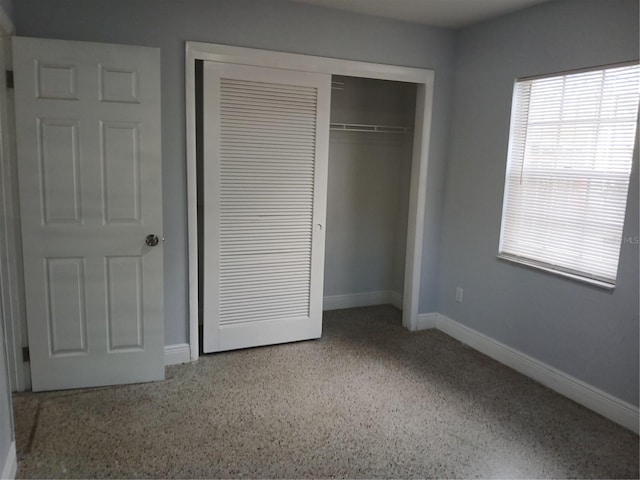 unfurnished bedroom featuring a closet