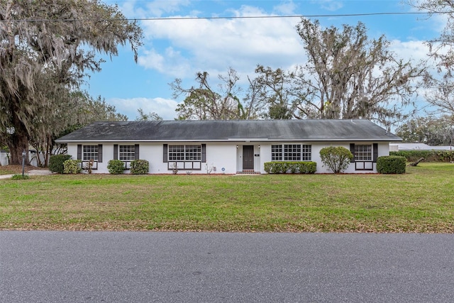 ranch-style home with a front yard