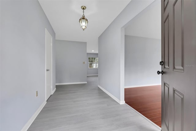 hall with light hardwood / wood-style floors