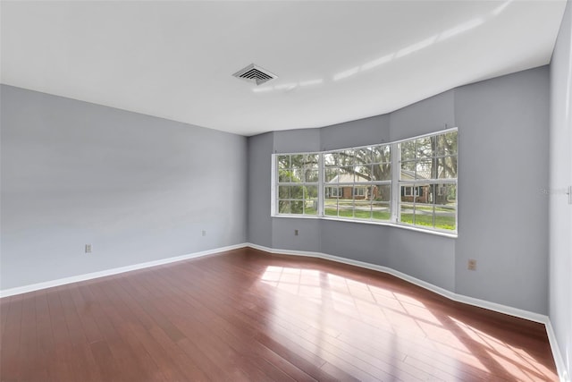 spare room with light hardwood / wood-style floors