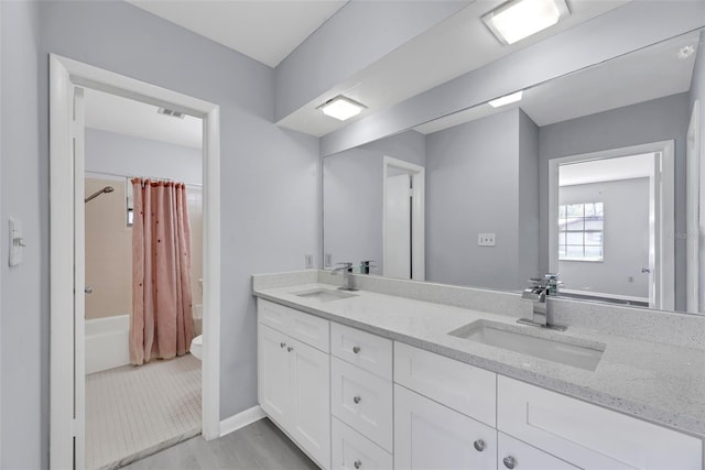 full bathroom featuring tile patterned flooring, toilet, vanity, and shower / bath combination with curtain