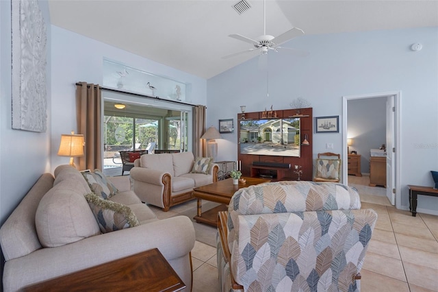 tiled living room with lofted ceiling and ceiling fan