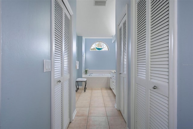 hallway with light tile patterned floors