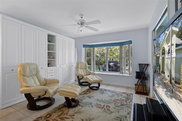 sitting room featuring ceiling fan and light tile patterned floors