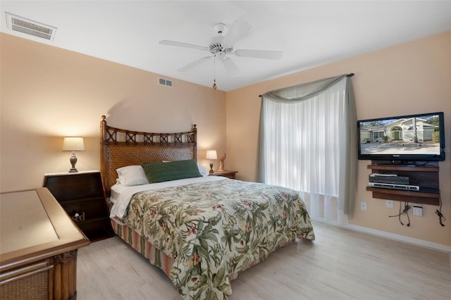 bedroom with ceiling fan and light wood-type flooring