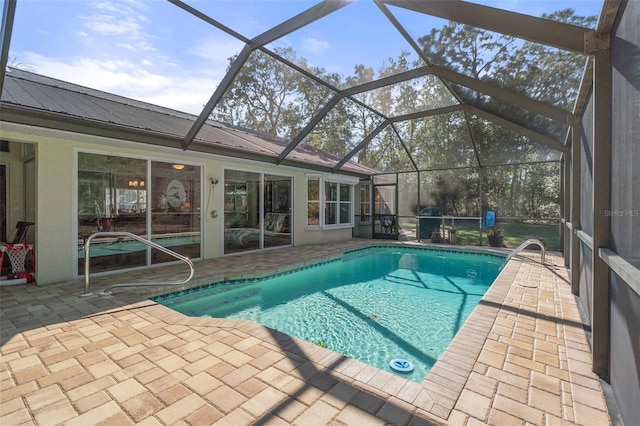 view of pool featuring a lanai and a patio area