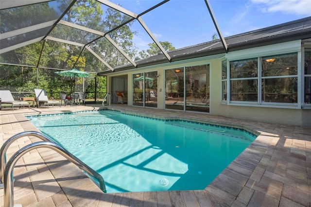 view of pool featuring a patio and a lanai