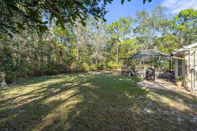 view of yard featuring a lanai