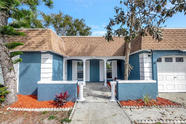 view of front of property featuring a garage