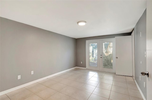 interior space with french doors and light tile patterned flooring