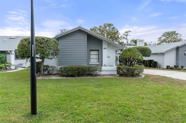 ranch-style house with a front yard