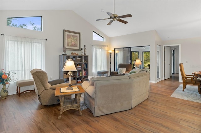 living room with ceiling fan, high vaulted ceiling, and hardwood / wood-style floors