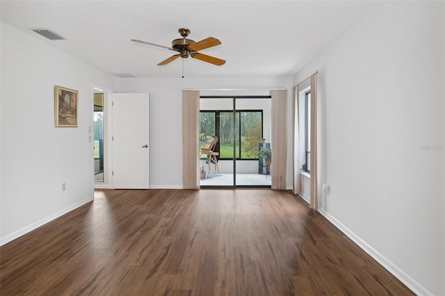 unfurnished room featuring ceiling fan and dark hardwood / wood-style flooring