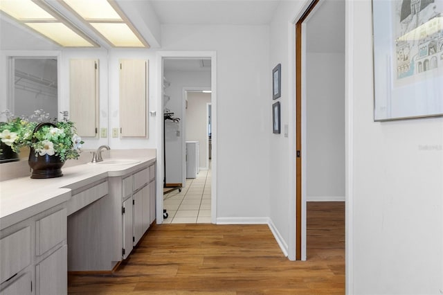 bathroom featuring wood-type flooring and vanity