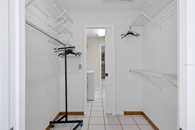 spacious closet with light tile patterned flooring