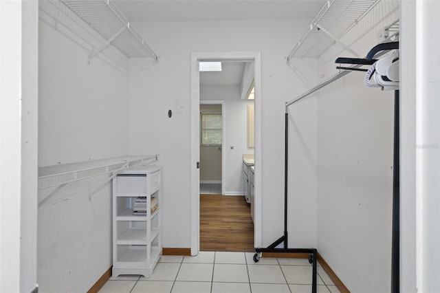 walk in closet featuring light tile patterned floors