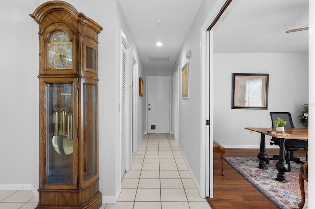 corridor with light tile patterned floors