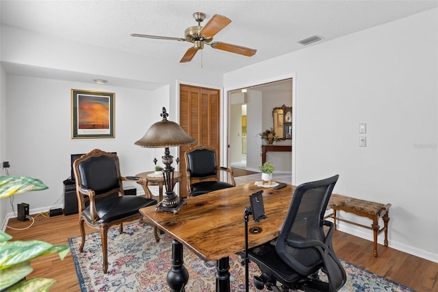 office area featuring hardwood / wood-style floors, a textured ceiling, and ceiling fan