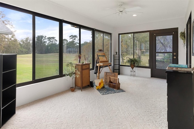 sunroom with ceiling fan