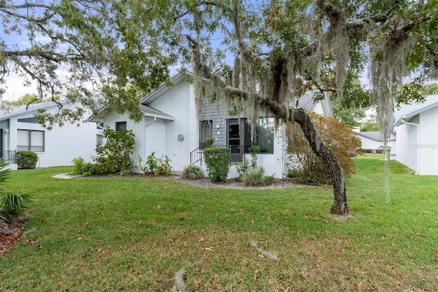 view of home's exterior with a yard