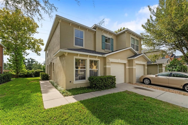 view of front of home featuring a garage and a front yard